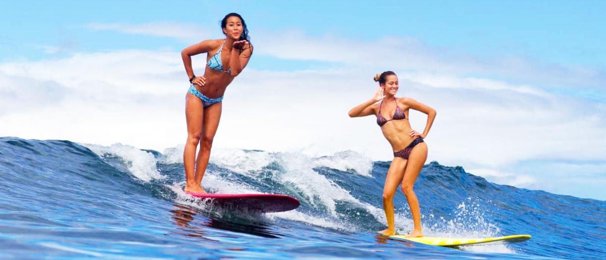 Two girls surfing in Guanacaste, Costa Rica