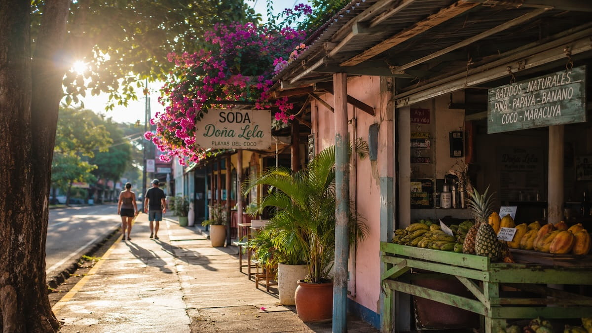 Couple walking down a street in Playas del Coco Costa Rica