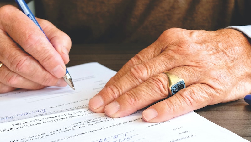 Person signing a real estate contract