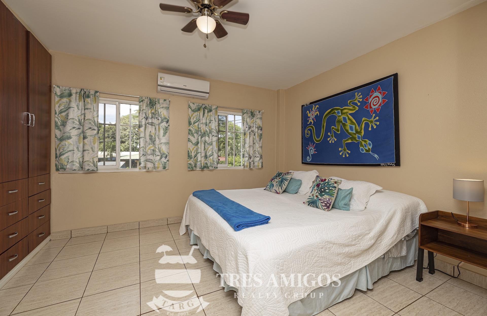air conditioned bedroom with closet and ceiling fan 