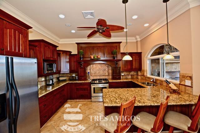 kitchen area with ceiling fan 