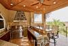 BBQ area and wet bar with ceiling fan